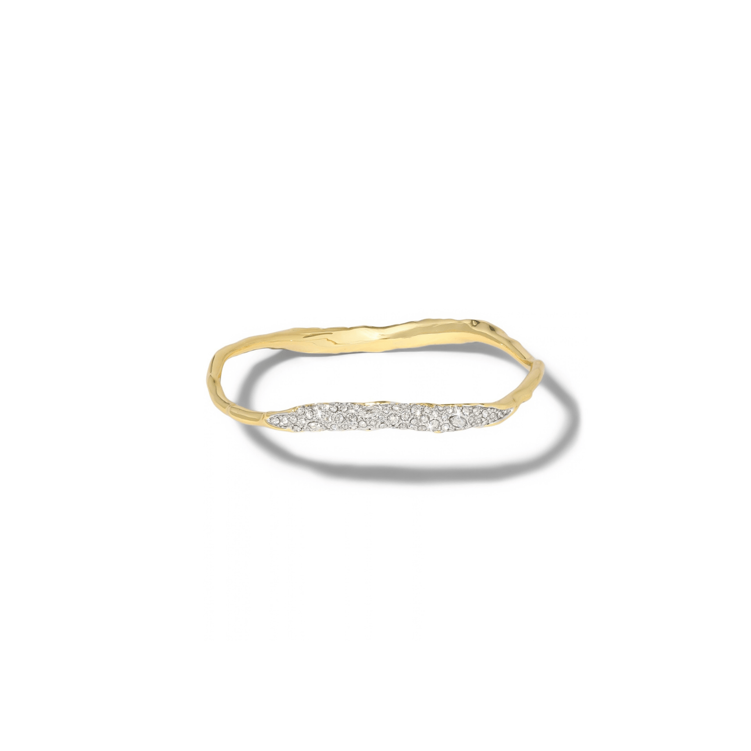 A gold bangle with a wavy, organic textured band and a horizontal row of small clear stones across the front, shown on a white background with a soft shadow.