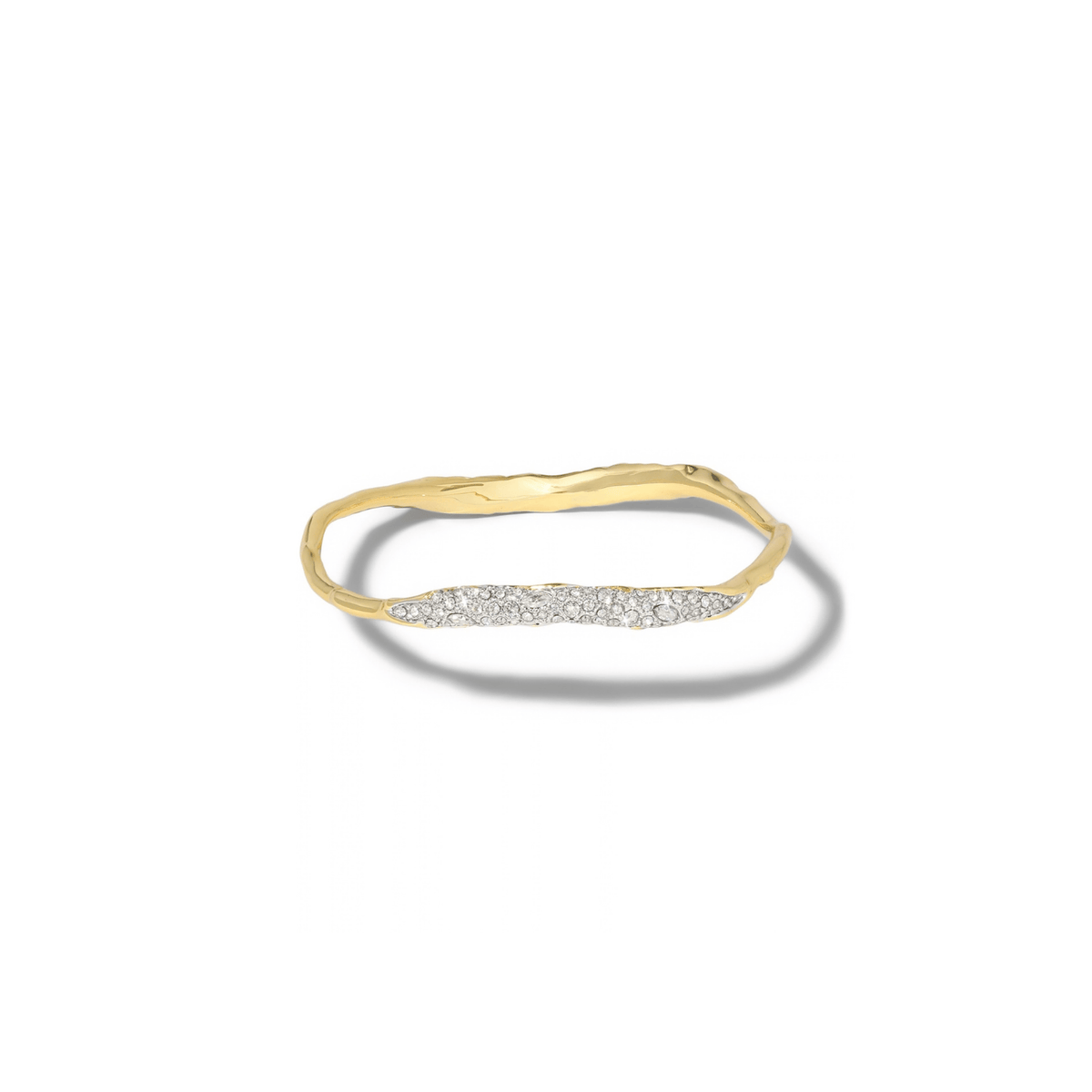 A gold bangle with a wavy, organic textured band and a horizontal row of small clear stones across the front, shown on a white background with a soft shadow.