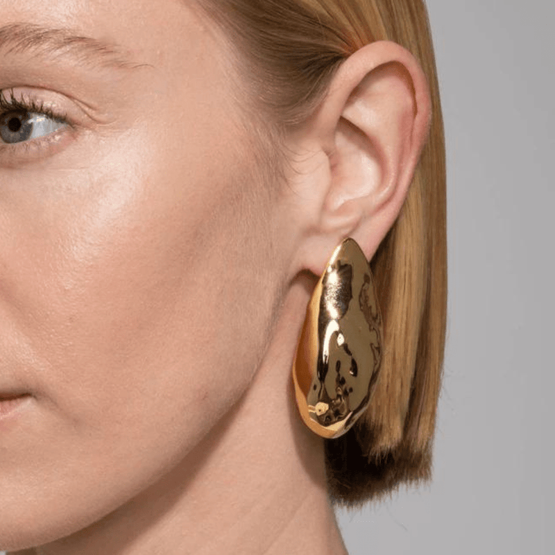 Large gold earrings with molten detail