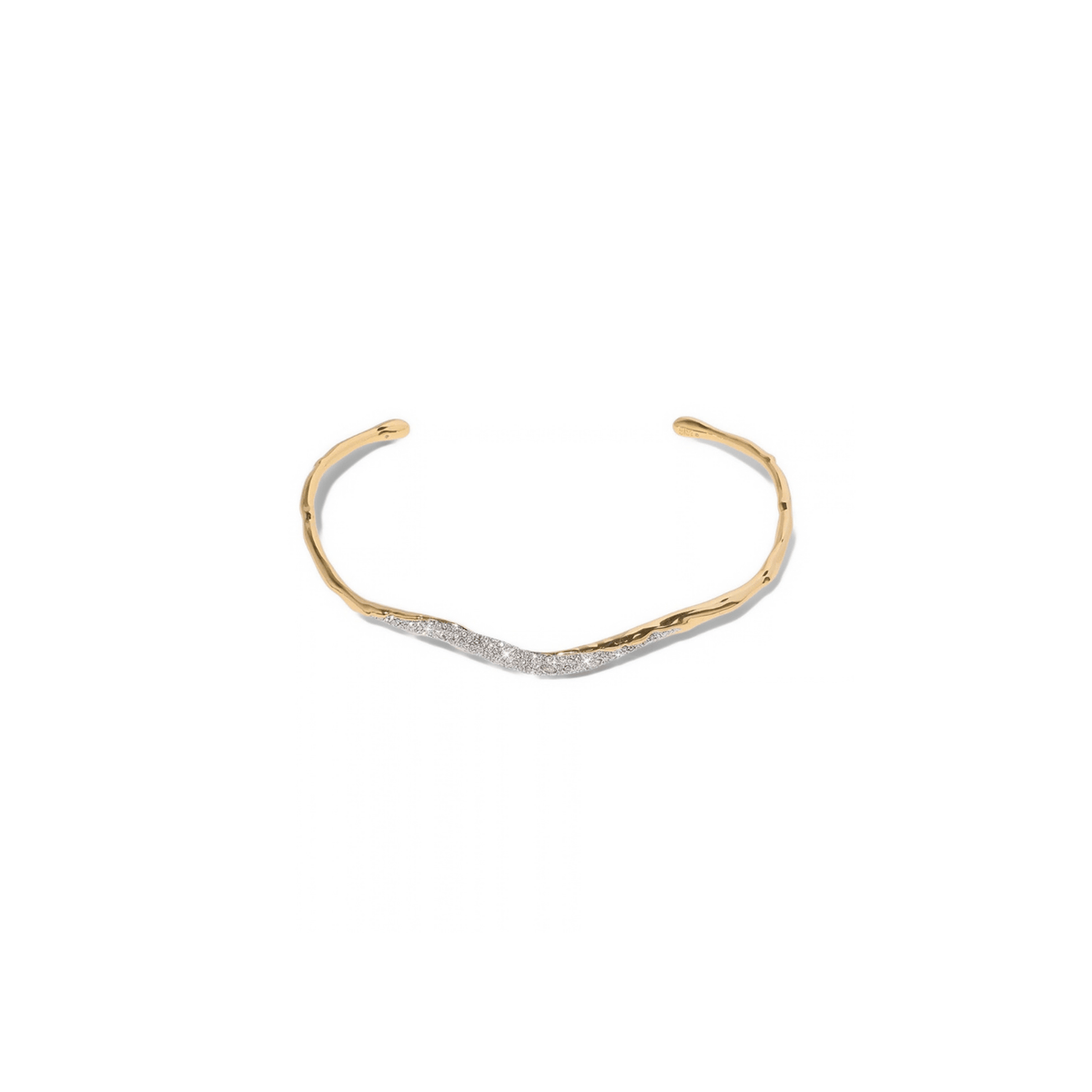 A gold open collar necklace with a textured, organic wavy design and a row of small clear pavé stones along the front curve, set against a plain white background.