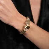 gold cuff with jagged edges and crystals