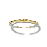 A gold open cuff bracelet with pavé-set clear stones along the front edges