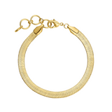 Gold bracelet with a textured design on a white background