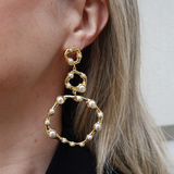 Gold hoop earrings with pearl accents 