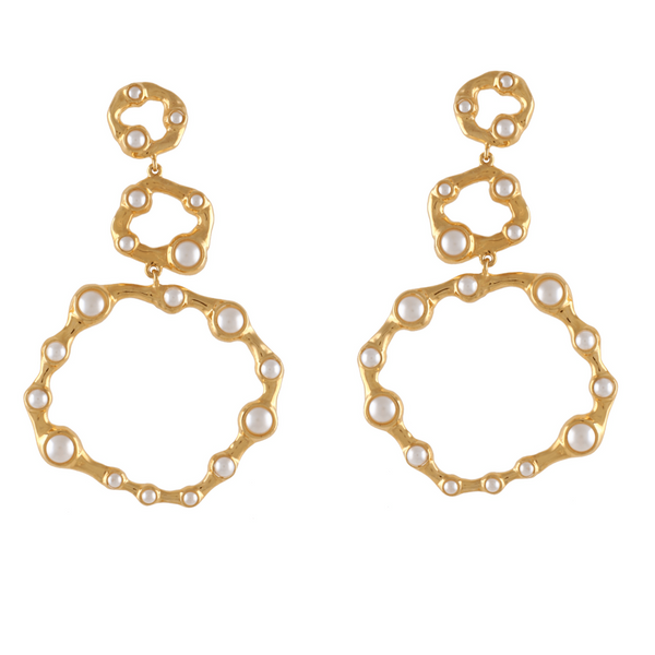 Gold earrings with circular designs and pearl-like beads on a white background
