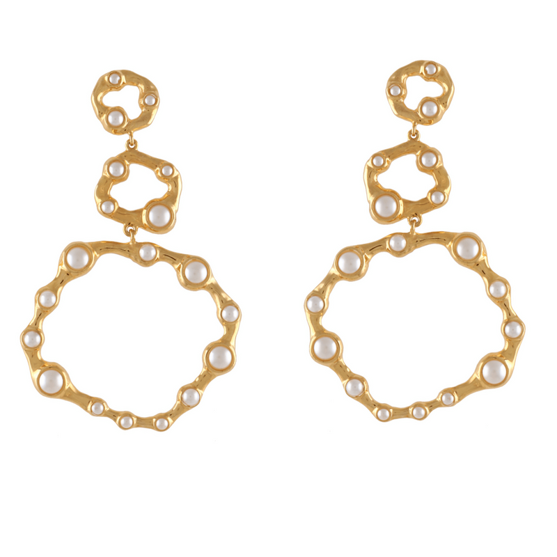 Gold earrings with circular designs and pearl-like beads on a white background