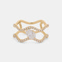 A gold ring with a wavy, openwork design, featuring a large oval center stone and small pavé-set clear stones along the curved bands, shown on a light gray background.