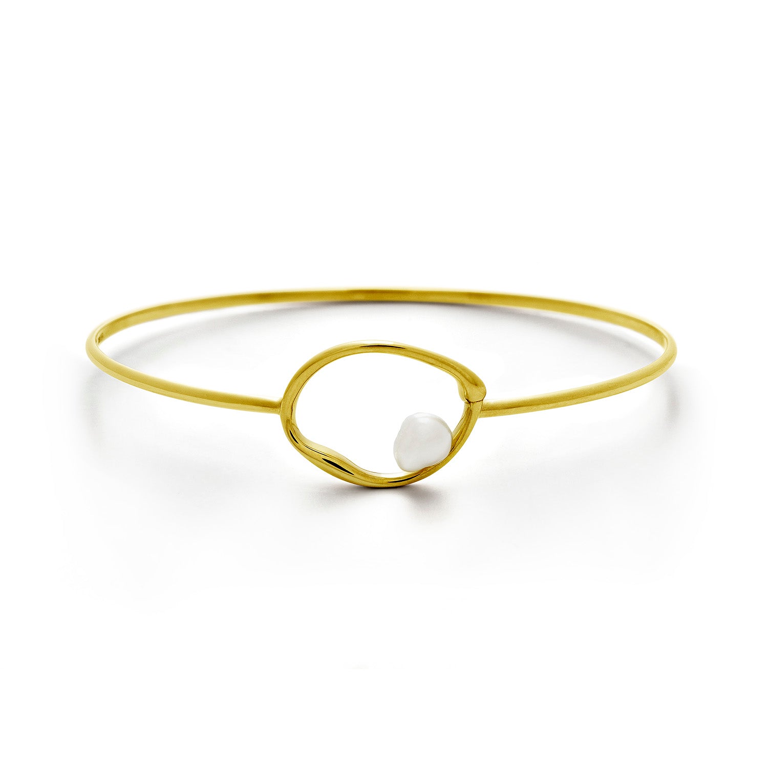A delicate gold bangle bracelet with a central open oval design and a small white pearl accent, shown on a clean white background.