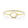 A delicate gold bangle bracelet with a central open oval design and a small white pearl accent, shown on a clean white background.