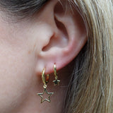 Star charm huggie earrings