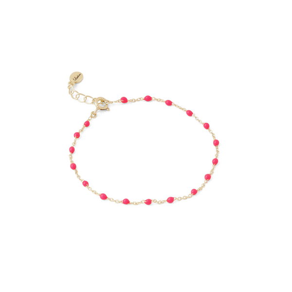 loulerie fashion bracelet with neon pink enamel bread on a gold chain 