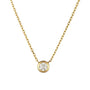 Gold necklace with a round diamond pendant on a white background