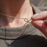 Gold bow-shaped necklace 