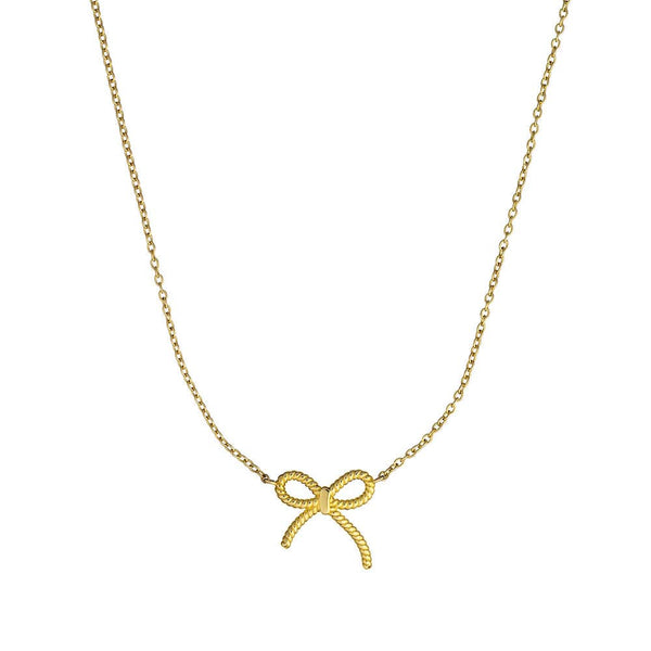 Gold bow-shaped pendant on a chain against a white background