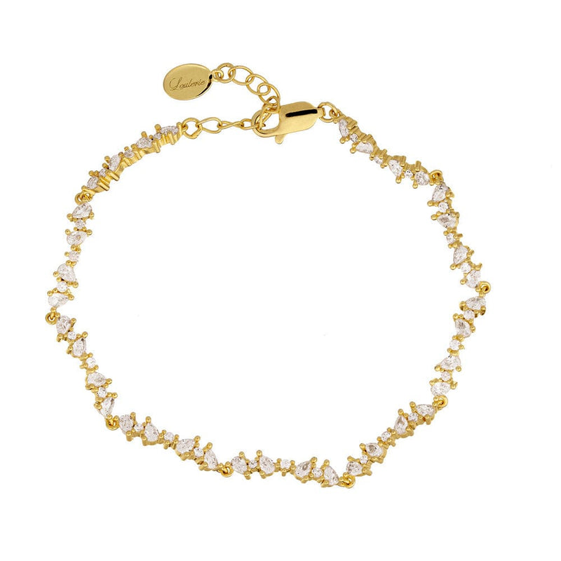 Gold bracelet with crystals on a white background