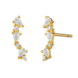 Gold earrings with crystals on a white background