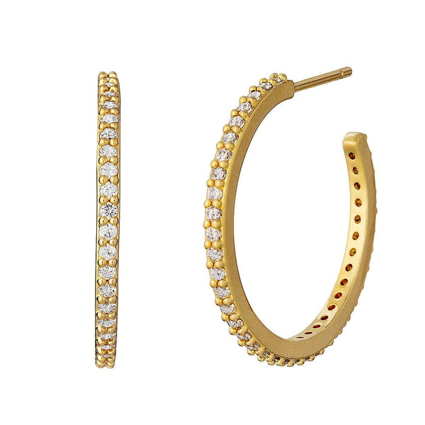 Gold hoop earrings with crystal accents on a white background