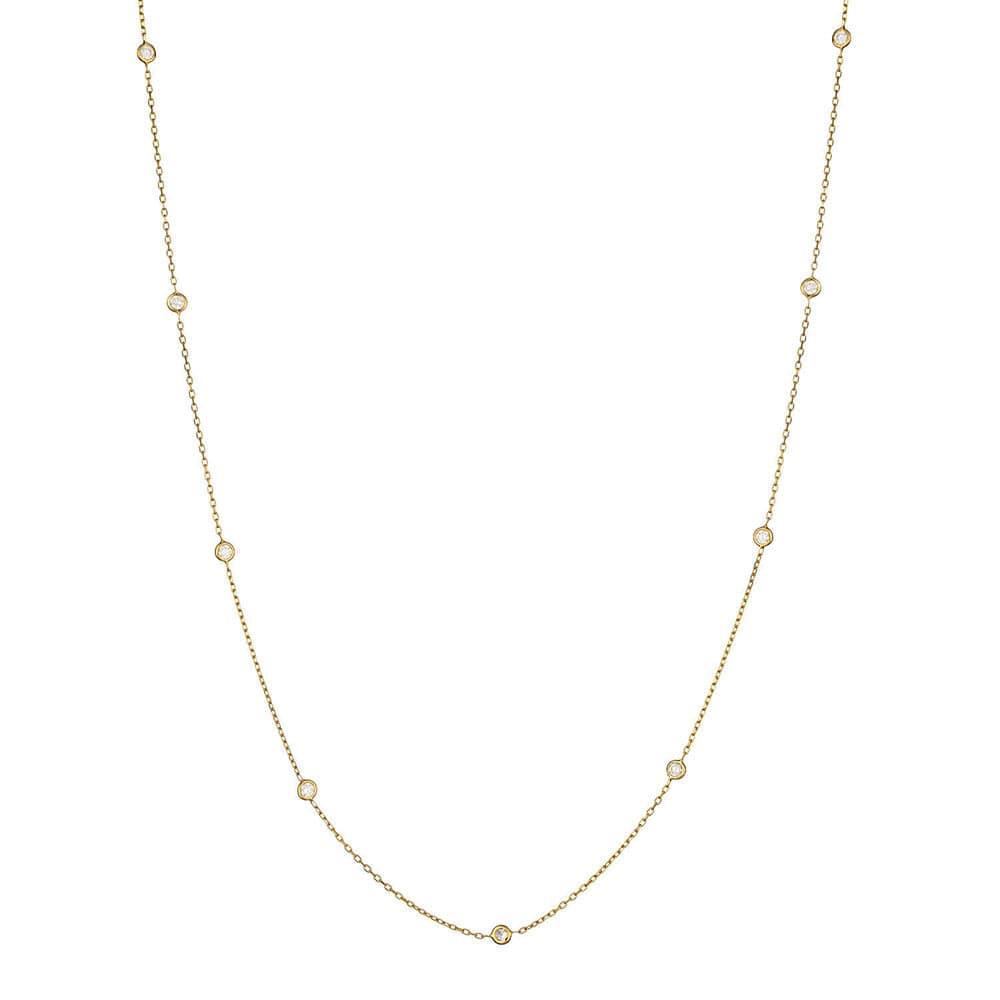Delicate gold necklace with small diamonds on a white background
