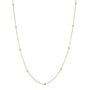 Delicate gold necklace with small diamonds on a white background