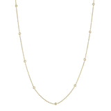 Delicate gold necklace with small diamonds on a white background