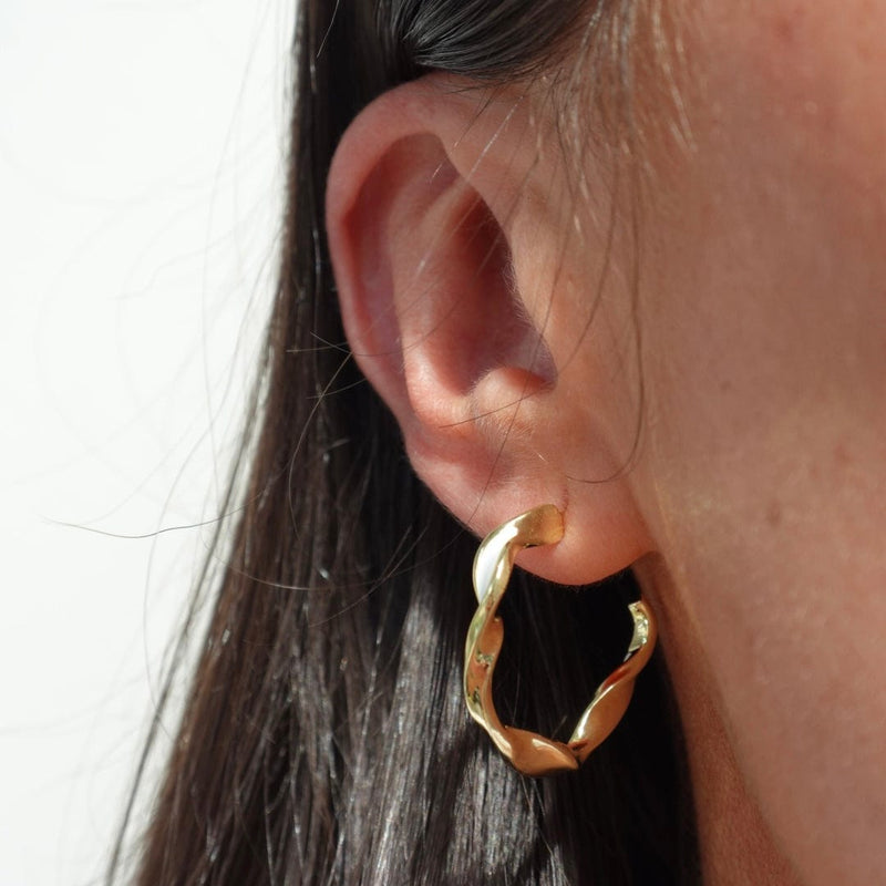 Small hoop twist earrings with gold and white enamel