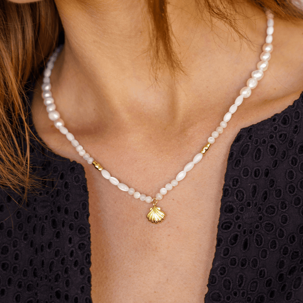 Gold pearl necklace with sea shell charm 