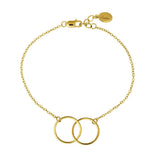 Gold bracelet with interlocking rings on a white background