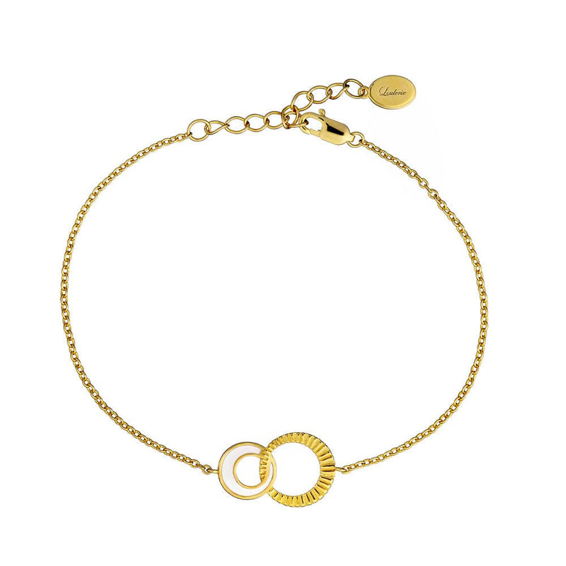 Gold bracelet with interlocking rings on a white background