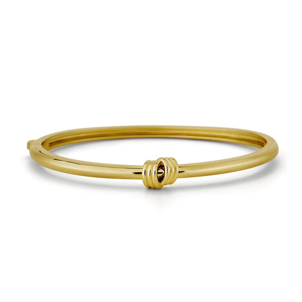 Gold knot  bracelet on a white background