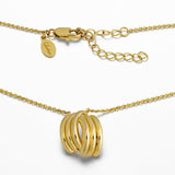 Gold necklace with three interlocking rings on a white background