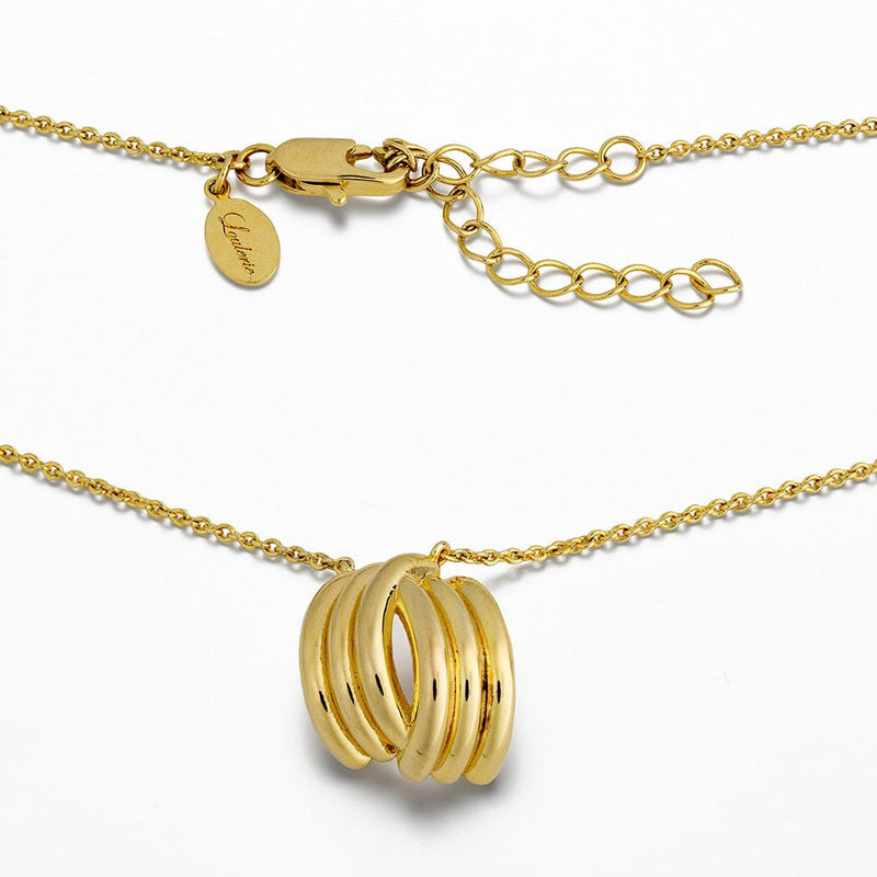 Gold necklace with three interlocking rings on a white background