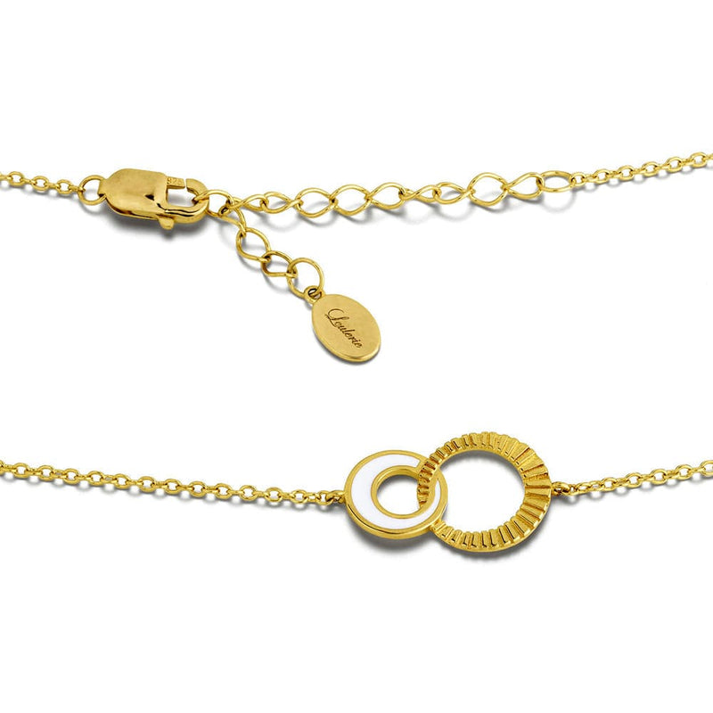 Gold necklace with a clasp and circular design on a white background