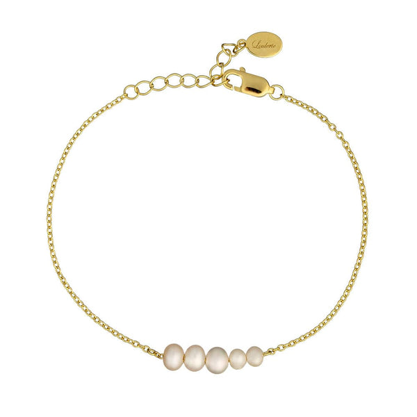 Gold bracelet with pearl beads on a white background