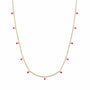 Gold necklace with pink enamel discs on a white background