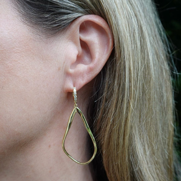 Sculptural teardrop earrings with crystal huggy closure