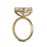 Gold ring with a large diamond on a white background