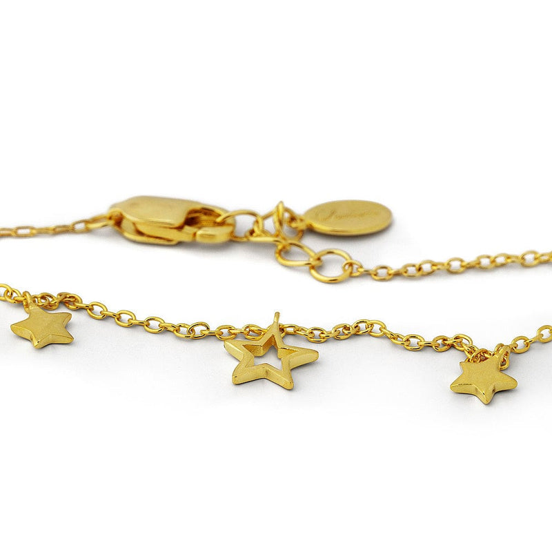 Gold bracelet with star charms on a white background