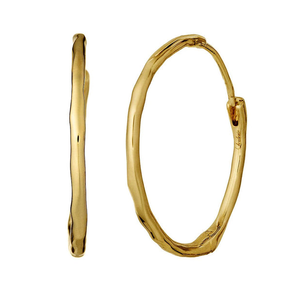 Gold hoop earrings on a white background
