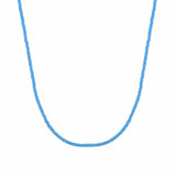 Blue beaded necklace on a white background