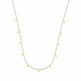Necklace with small yellow beads on a white background