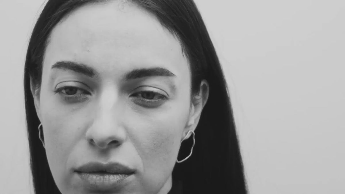 A video of a model wearing Louise Petersen fine jewellery earrings, necklaces and rings